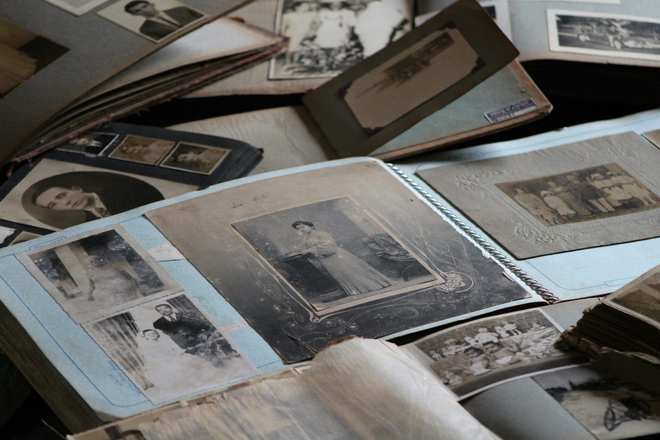 ld family photos displayed in a vintage photo album, capturing memories and moments from the past.